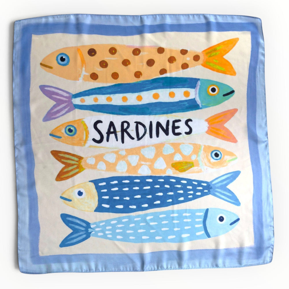 Blue silky square scarf featuring colourful illustrated sardines in orange, turquoise, yellow and navy, with a powder-blue border and ivory background.