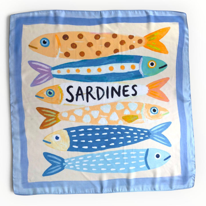 Blue silky square scarf featuring colourful illustrated sardines in orange, turquoise, yellow and navy, with a powder-blue border and ivory background.